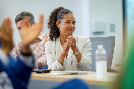 Smiling employee sitting in chair
